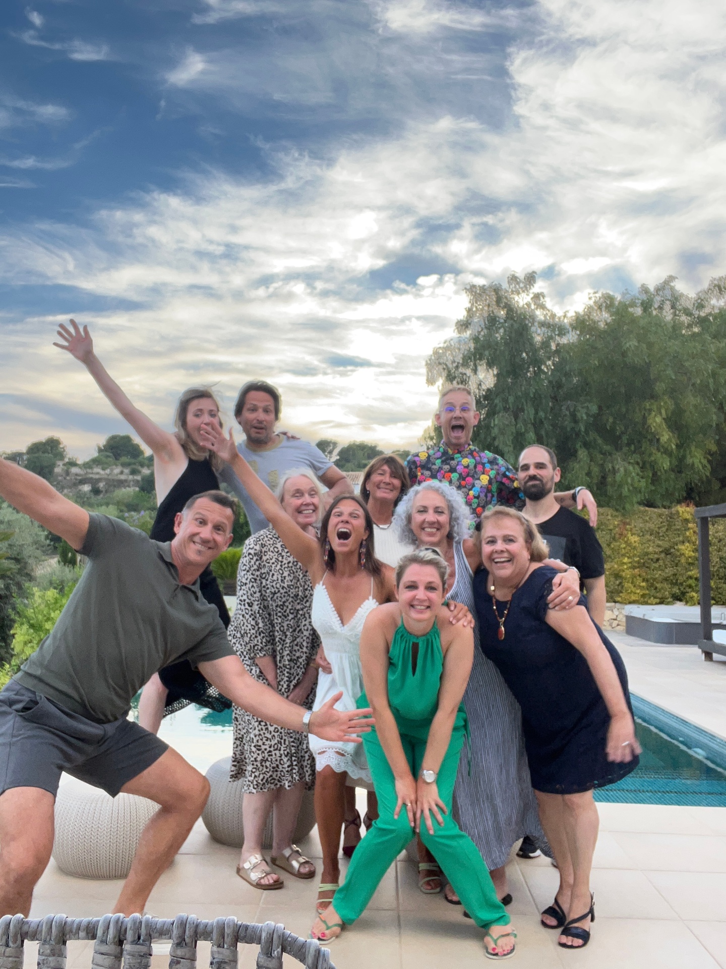 Group celebrating together with a toast at dinner