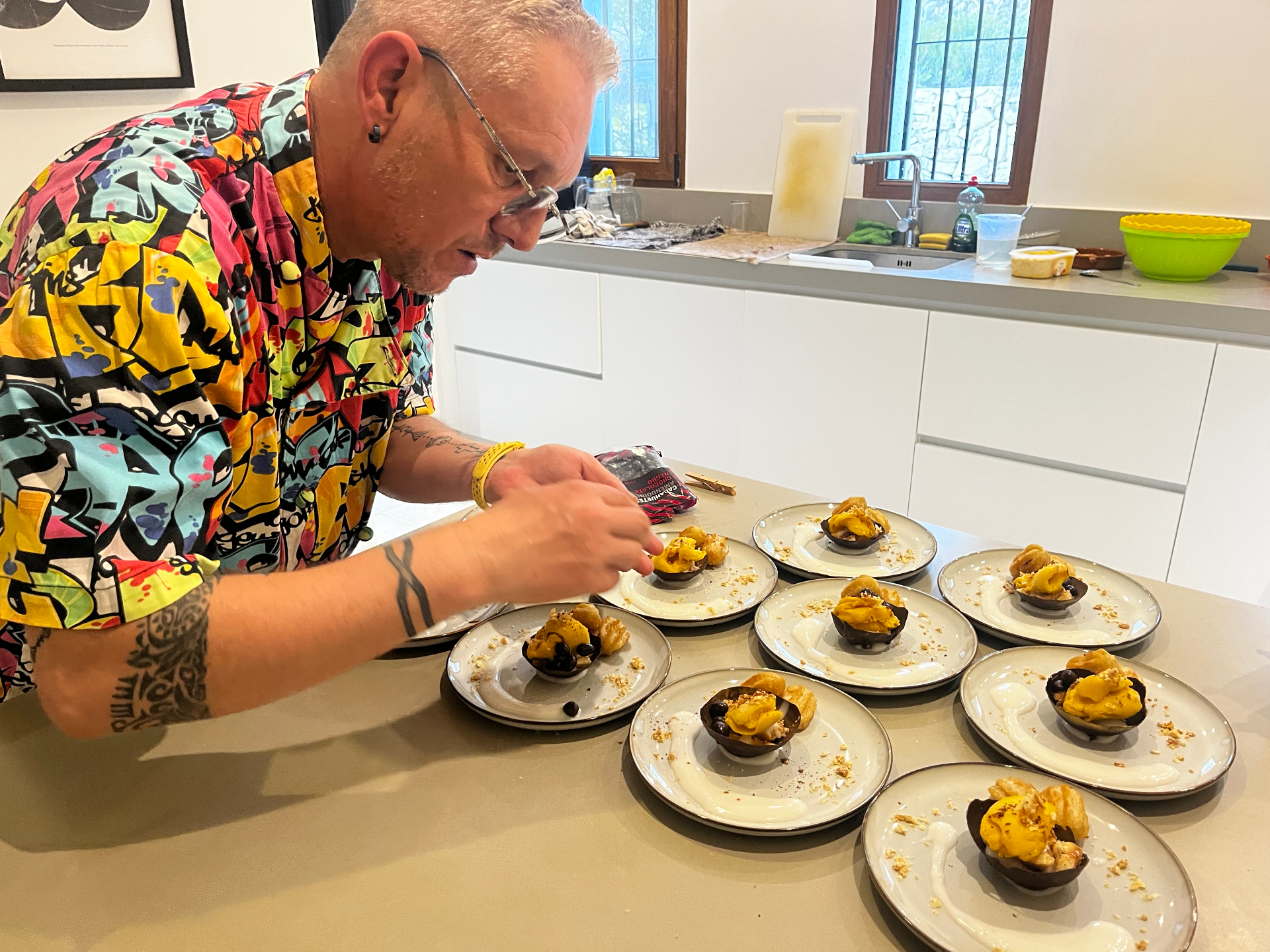 Chef preparing colourful plant-based dishes in the Sana Sana kitchen